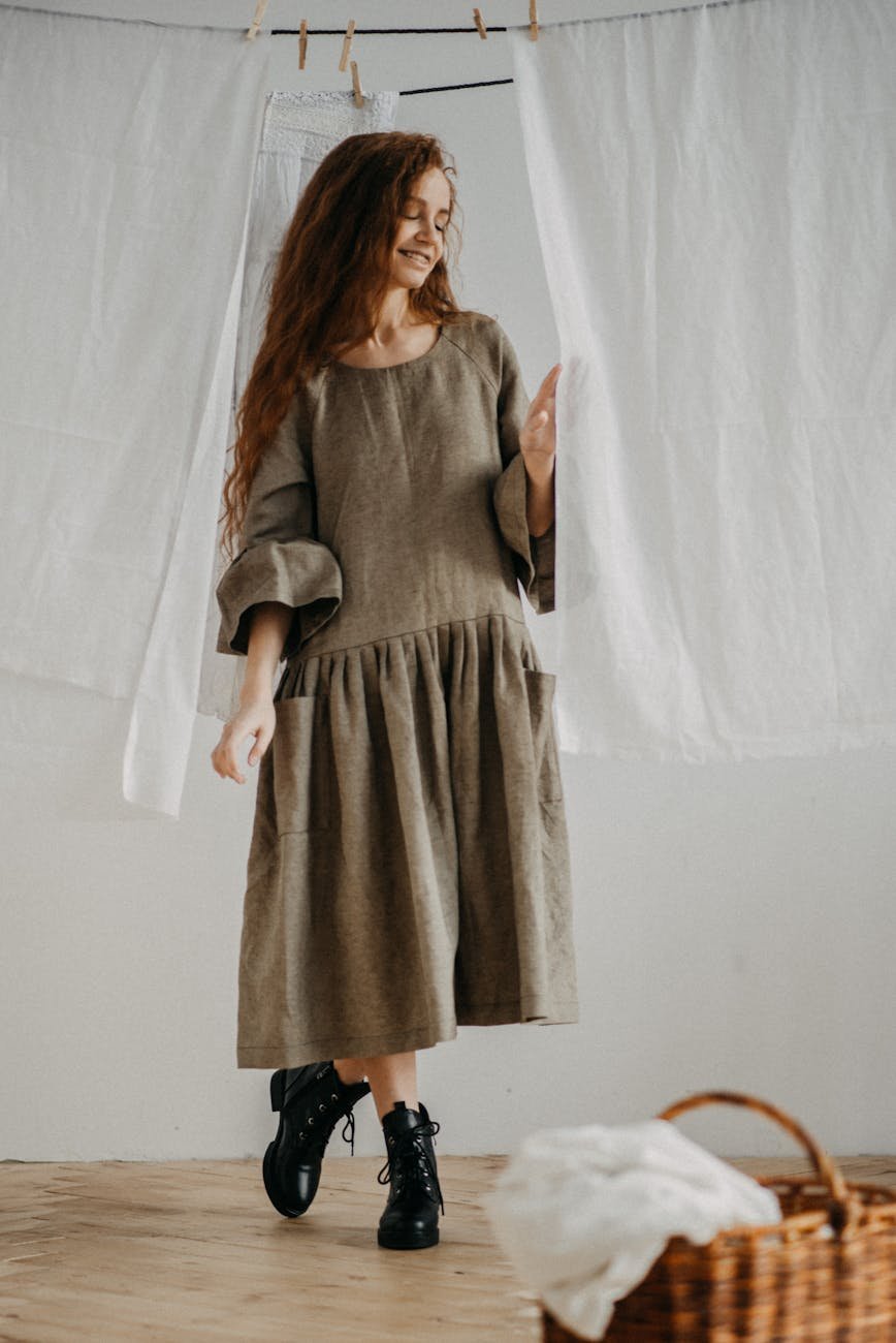 smiling woman near white fabric