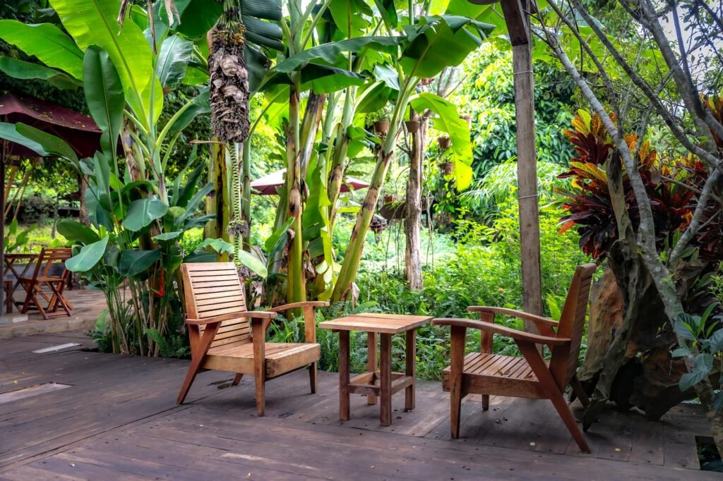 table and armchairs in tropical garden